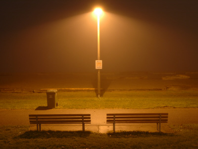 Two Benches And Overhead Light At Beach At Night by David Elton Pricing Limited Edition Print image