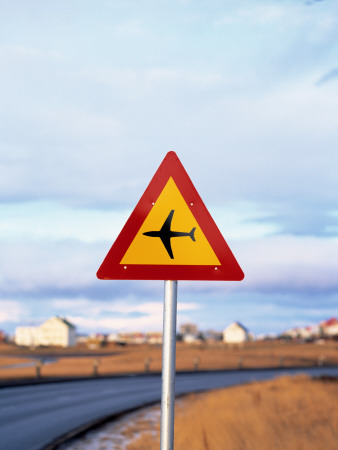 A Sign By A Road, Warning That There Is An Airport Nearby by Fridrik Orn Hjaltested Pricing Limited Edition Print image