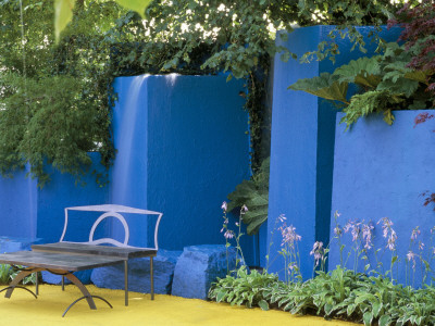 Contemporary Metal Garden Furniture, Vivid Blue Walls, Yellow Concrete Floor And Hostas, Hampton by Clive Nichols Pricing Limited Edition Print image