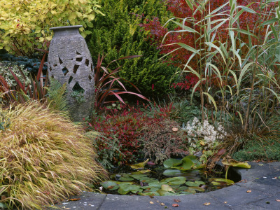 Lakemount, Ireland - Granite Urn Resting In Autumnal Border Near Small Pond, Designer: Brian Cross by Clive Nichols Pricing Limited Edition Print image