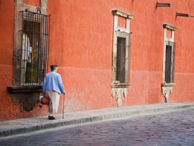 Woman Walking The Streets, San Miguel De Allende, Mexico by Julie Eggers Pricing Limited Edition Print image
