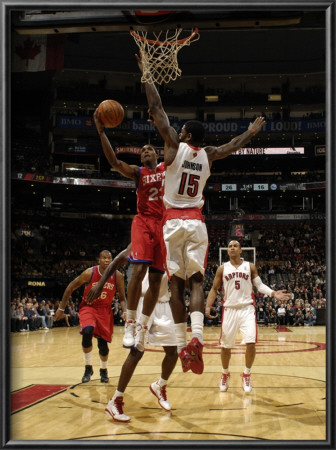 Philadelphia 76Ers V Toronto Raptors: Louis Williams And Amir Johnson by Ron Turenne Pricing Limited Edition Print image