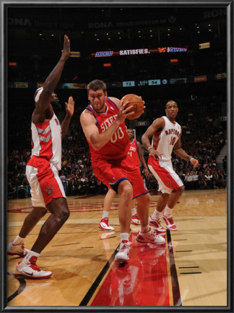 Philadelphia 76Ers V Toronto Raptors: Spencer Hawes And Reggie Evans by Ron Turenne Pricing Limited Edition Print image