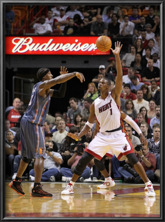 Charlotte Bobcats V Miami Heat: Chris Bosh And Gerald Wallace by Mike Ehrmann Pricing Limited Edition Print image