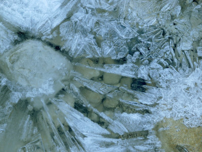 Close-Up Of A Frozen Stream With Ice Crystals And Pebbles by Stephen Sharnoff Pricing Limited Edition Print image
