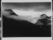 In Glacier National Park, Mysterious Cloudy Mountain Landscape At Glacier National Park by Ansel Adams Limited Edition Print