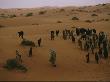 A Saudi Man Drives His Goat Herd Through The Desert by Reza Limited Edition Print
