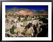 Seven Colours Hill Above Andean Village Of Quebrada De Humahuaca, Purmamarca, Argentina by Michael Taylor Limited Edition Print