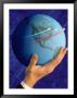 Businessman's Hand Holding Globe by Guy Crittenden Limited Edition Print