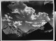 Cumulus Clouds Hovering Over Snow-Covered Mountain Landscape, At Glacier National Park by Ansel Adams Limited Edition Print