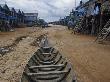 Houses Built On Stilts Stand High And Dry In Kompong Phluk by Robert Clark Limited Edition Print