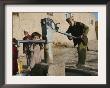 An Elderly Man Pumps Water From A Public Well In Kabul, Afghanistan, Friday, September 22, 2006 by Rodrigo Abd Limited Edition Pricing Art Print