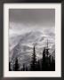 Emmons Glacier Reflects A Bit Of Sunlight As Clouds Cover The Summit Of Mount Rainier by John Froschauer Limited Edition Print