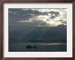 A Kashmiri Fisherman Rows His Boat At Dawn On The Dal Lake, Srinagar, India, Tuesday, April 5, 2005 by Rafiq Maqbool Limited Edition Print