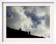 Two Tourists Walk In The Ruins Of Machu Pichu, Peru by Tomas Munita Limited Edition Print