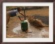 A Child Fills A Container With Water For Domestic Use by Mujahid Safodien Limited Edition Pricing Art Print