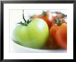 Green Tomato With Red Tomatoes In A Bowl by David Loftus Limited Edition Print