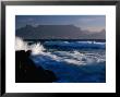 Wave Crashing On Rocks With Table Mountain In Distance, Cape Town, South Africa by Carol Polich Limited Edition Pricing Art Print