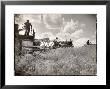 Kansas Farmer Driving Farmall Tractor As He Pulls A Manned Combine During Wheat Harvest by Margaret Bourke-White Limited Edition Print