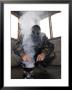 A Marine Fills The Marine Corps Air Station Futenma Gas Chamber With More Cs Gas by Stocktrek Images Limited Edition Print