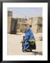 Lady Wearing Burqa Walks Past Houses Within The Ancient Walls Of The Citadel, Ghazni, Afghanistan by Jane Sweeney Limited Edition Print