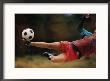 A Man Bends Sideways As He Kicks A Soccerball by Dugald Bremner Limited Edition Pricing Art Print