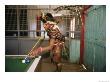 A Huli Wigman Plays Pool In A Pub During The Annual Sing-Sing In Goroka by Jodi Cobb Limited Edition Pricing Art Print