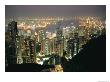 The Hong Kong Skyline Is Lit Up At Night With Thousands Of Lights by Paul Chesley Limited Edition Print