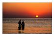 Couple Holding Hands At Sunset Over The Bay Of Alcudia, Mallorca, Balearic Islands, Spain by David Tomlinson Limited Edition Print