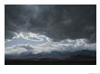 Storm Clouds Brew Over The Panamint Range And Salt Pan In Death Valley by Gordon Wiltsie Limited Edition Print