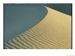 A Sand Dune Is Highlighted By The Rising Sun by Marc Moritsch Limited Edition Print