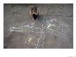 A Young Girl Admires A Drawing That She Did With Sidewalk Chalk by Joel Sartore Limited Edition Print