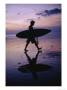 A Surfer Walks Along Kuta Beach At Dusk With His Surfboard In Hand by Eightfish Limited Edition Print