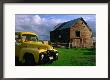 Old Barn And Yellow Pick-Up Truck In Montana, Montana, Usa by Carol Polich Limited Edition Print