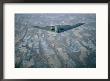 A B-2 Stealth Bomber Flies Above The Patterned Terrain Of Southwestern Nebraska by Joel Sartore Limited Edition Pricing Art Print