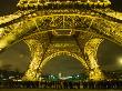 Line Of Tourists Queuing Under Eiffel Tower At Night, Paris, France by Kevin Levesque Limited Edition Print