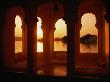 Sunset Over Lake Pichola Seen Through Arch Windows Of Jagat Niwas Hotel, Udaipur, Rajasthan, India by Dallas Stribley Limited Edition Print