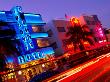 Car Light Trails Passing Neon Lights Of Art Deco Hotels On Ocean Drive, South Beach, Miami, Florida by Eddie Brady Limited Edition Print