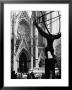 Entrance To St. Patrick's Visible Across Fifth Avenue, With Atlas Statue Silhouetted In Foreground by Andreas Feininger Limited Edition Pricing Art Print