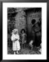 Lorenza Curiel In White First Communion Dress Waiting For Mother To Lock Door by W. Eugene Smith Limited Edition Print