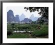 Farmland On Edge Of Town, Among The Limestone Towers, Yangshuo, Guangxi, China by Tony Waltham Limited Edition Print