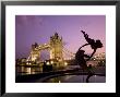 Tower Bridge And Girl With A Dolphin Fountain Statue At Dusk, London, England by Michele Falzone Limited Edition Pricing Art Print