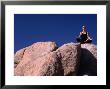 Yoga On The Rocks In The Joshua Tree National Park, California, Usa by Cheyenne Rouse Limited Edition Print