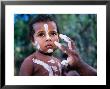 Boy Being Decorated For Performance With Injinoo Dance Troupe, Cape York Peninsula, Australia by Oliver Strewe Limited Edition Print