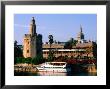 Boat On River In Front Of Torre Del Oro, Sevilla, Andalucia, Spain by John Elk Iii Limited Edition Print