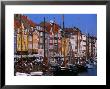 Yachts Moored In Front Of Cafes At Nyhavn, Copenhagen, Denmark by Holger Leue Limited Edition Print