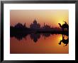 Taj Mahal And Silhouetted Camel And Reflection In Yamuna River At Sunset by Richard I'anson Limited Edition Pricing Art Print