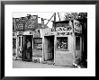 Shack Like Black Jeweler Shop Next To Food Store Covered With Ads In A Slum Section Of The City. by Alfred Eisenstaedt Limited Edition Print