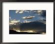 Silhouetted Figure Trail Running Under A Cloud Filled Sky by Bobby Model Limited Edition Print