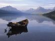 View Of Empty Boat On Mcdonald Lake, Glacier National Park, Montana by Oote Boe Limited Edition Print